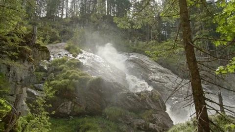 Waterfall in the mountains. Water flowing between rocks in the forest. Fast m Video stock 144490775