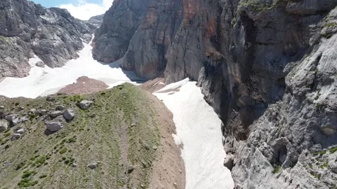 Waterfall in the mountains. The wind blows off jets of water. Aerial photography Stock Footage 137077425