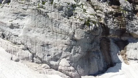 Waterfall in the mountains. The wind blows off jets of water. Aerial photography Stock Footage 137077492