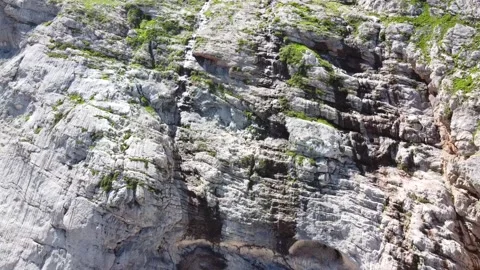 Waterfall in the mountains. The wind blows off jets of water. Aerial photography Stock Footage 137077520