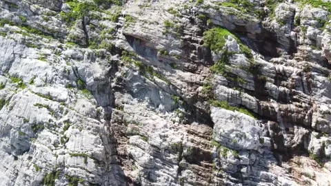 Waterfall in the mountains. The wind blows off jets of water. Aerial photography Stock Footage 137077630