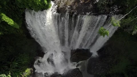 Waterfall in a natural rainforest in Laos Stock Footage 248596808