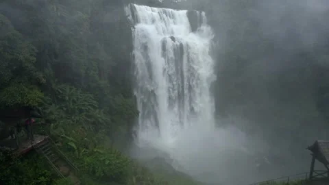 Waterfall in a natural rainforest in Laos Stock Footage 248660971