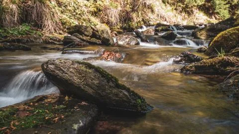 Waterfall or cascade on small river in forest. Velke losiny, Czech Republic. Stock Photos