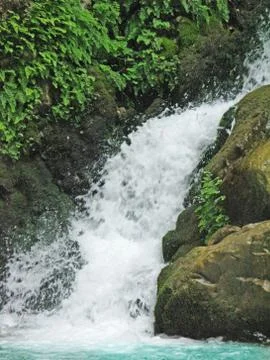 Waterfall out of grotto Stock Photos