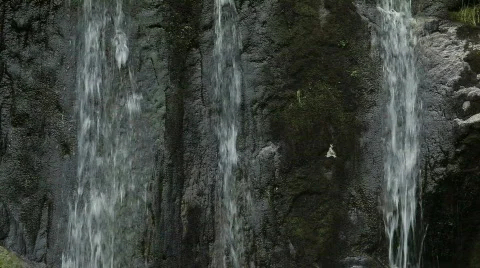 Waterfall over dark rocks Stock Footage 726234