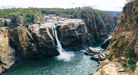 Waterfall over the side of a gorge into the Herbert River Stock Photos