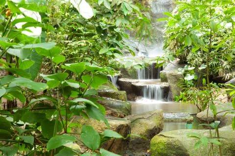 Waterfall in the park. Stock Photos