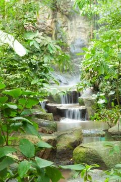 Waterfall in the park. Stock Photos