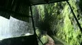 Waterfall passage with tunnel in rainforest 20110429 152621p5 HD Footage