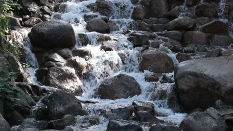 Waterfall pouring down the rocks Stock Footage 132685610
