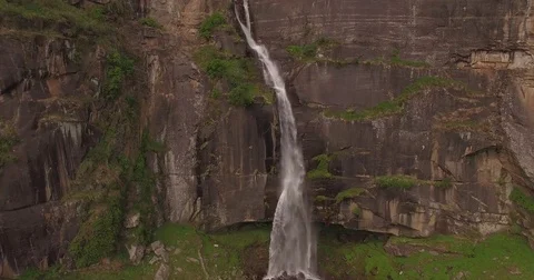 Waterfall Pours Down Side of Cliff Stock Footage 80954508