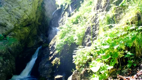 Waterfall produced by the rio arno in the mountain area of the gran sasso Video stock 136824214