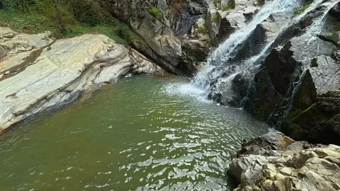 Waterfall Profile View 4K - Cinematic Side Angle of Rushing Water &amp; Rocks Video stock 332147010