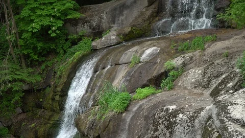 Waterfall in public park, fast streaming water. Stock Footage 107996289