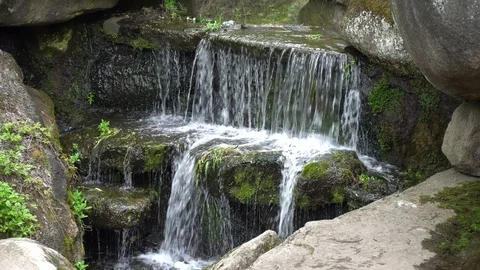Waterfall in public park, fast streaming water. Stock Footage 107996393