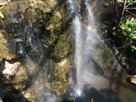 Waterfall with a rainbow across Foto stock