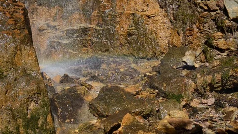 Waterfall with rainbow  in the forest. Drops and colors Stock Footage 90629328