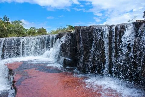 Waterfall with red rocks in La Gran Sabana, Venezuela Stock Photos
