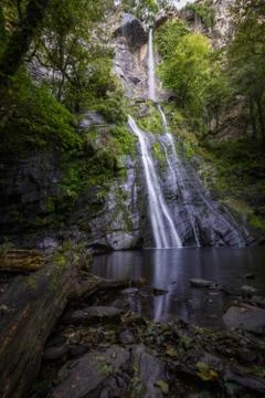 Waterfall Reflected in the Pond at its base Stock Photos