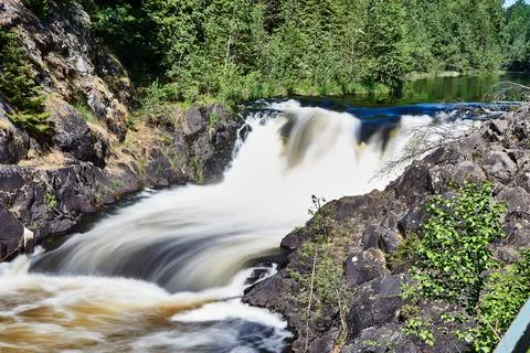 Waterfall on a river in a forest area Stock Photos