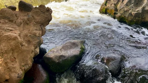 Waterfall from river. Mountain river with a waterfall and stones in lake. Stockbeeldmateriaal 218655727