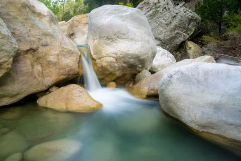 Waterfall on river in mountains Stock Photos