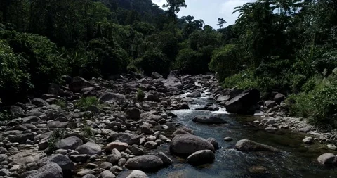 Waterfall river with rocky mountain flying movement by drone nature landscape Stock Footage 133358392