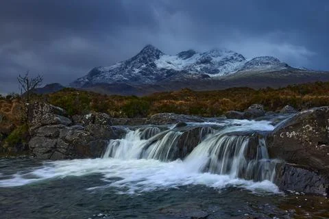 Waterfall on River Sligachan on the Isle of Skye Scotland with large mountain Stock Photos