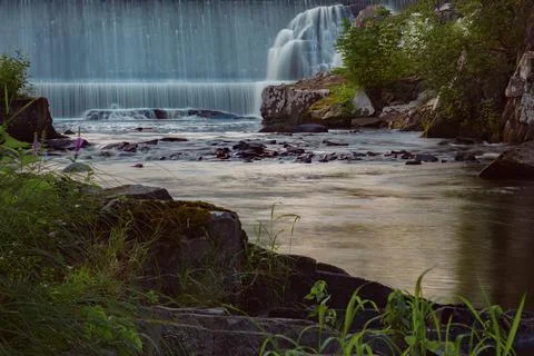 Waterfall river stream flowing water in the forest Stock-Fotos