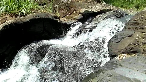 Waterfall on river stream shot on the side Video stock 123689031