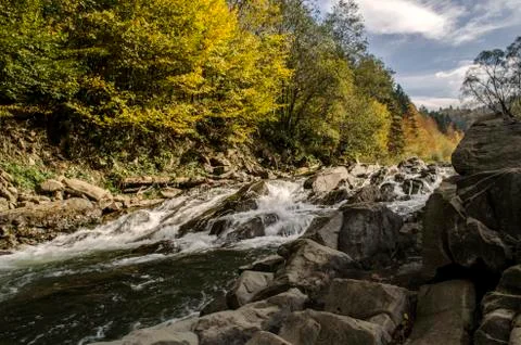 Waterfall on the river in the sun Stock Photos
