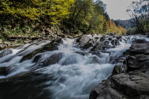 Waterfall on the river in the sun Stock Photos