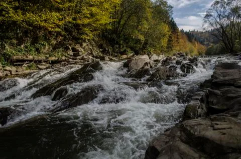 Waterfall on the river in the sun Stock Photos