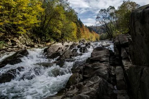 Waterfall on the river in the sun Stock Photos
