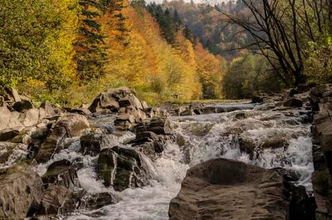 Waterfall on the river in the sun Stock Photos