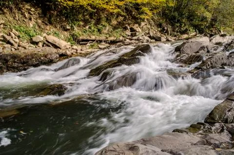 Waterfall on the river in the sun Foto stock