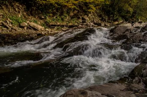 Waterfall on the river in the sun Stock Photos