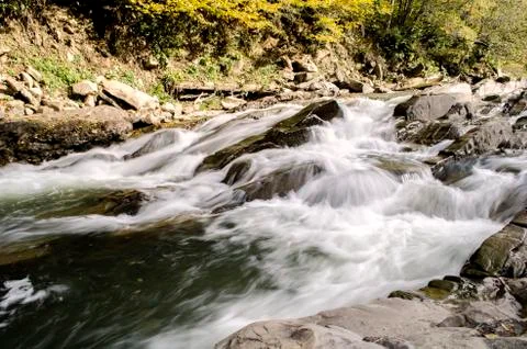 Waterfall on the river in the sun Stock Photos