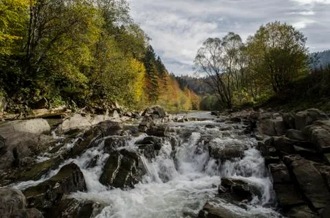 Waterfall on the river in the sun Stock Photos