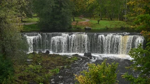 Waterfall with roaring and foaming water in Keila Joa park in autumn. Stock Footage 236012403