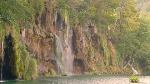 Waterfall on the Rock in the Lake Stock Footage 69917467