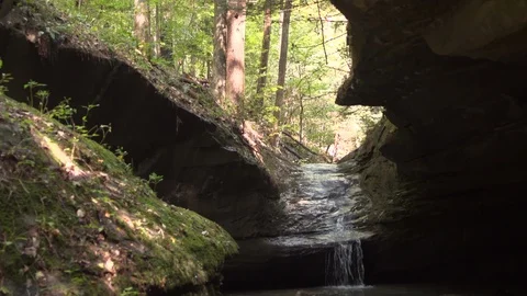 Waterfall in rock with moss Tilt down Wide from creek Stock-Footage 95500623