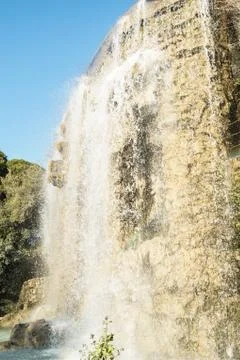 Waterfall on a rock. Стоковые фото