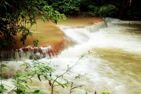 Waterfall on a rock. Stock Photos