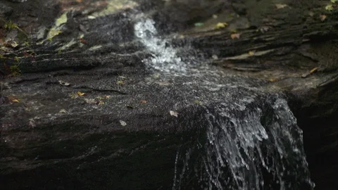 Waterfall in rock Slow Motion Close from side Stock Footage 95499366
