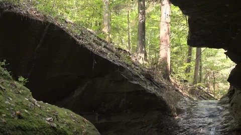 Waterfall in rock Tilt down Pan right Wide from creek Stock-Footage 95499540