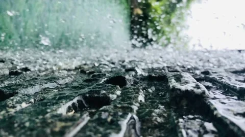 The waterfall on the rock wall is a horizontal clip from the transmission. Stock Footage 140890430