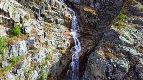 Waterfall, rocks and mountains Stock Footage 163771356