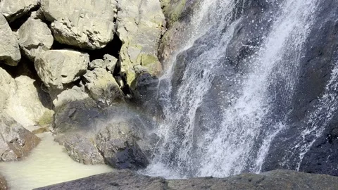 Waterfall with Rocks and Rainbow Stock Footage 328963774
